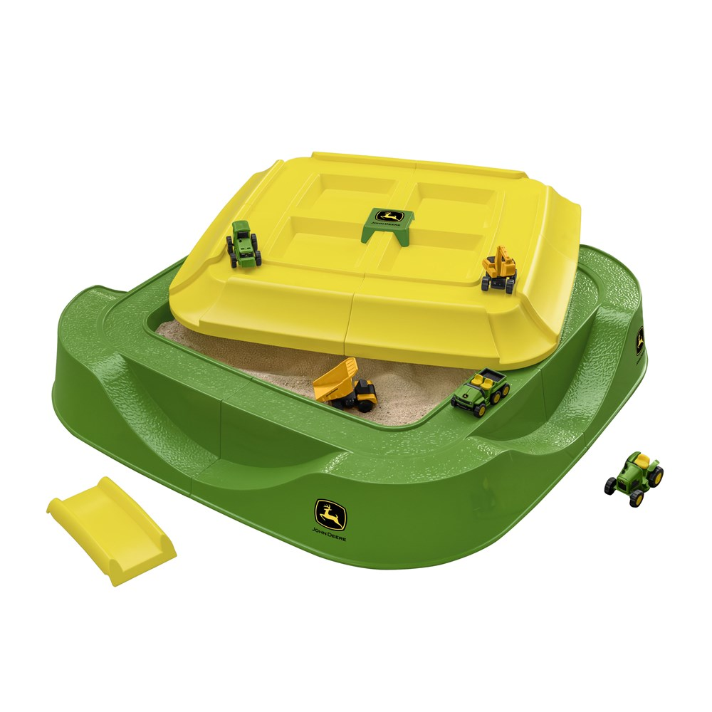 Green John Deere sand pit with yellow lid, removable ramp and five toy construction and farm vehicles