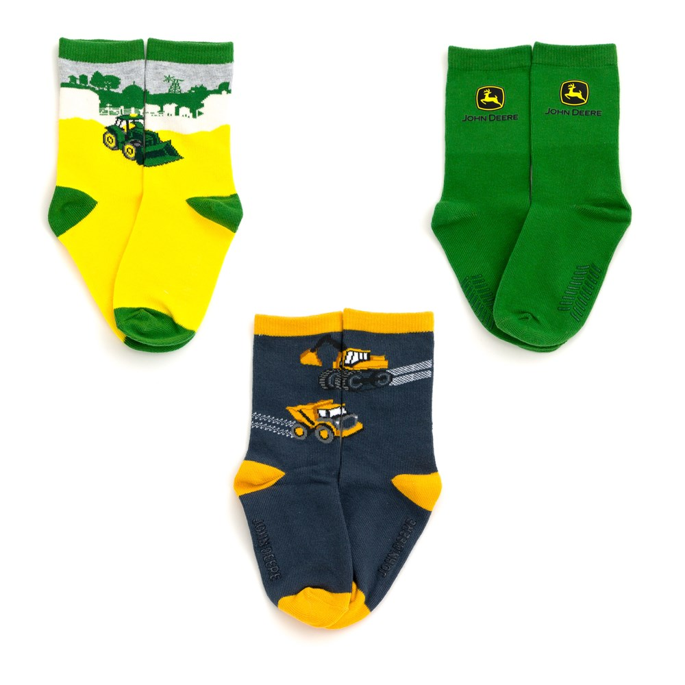 Three pairs of John Deere kids crew socks in yellow, green and navy with tractor, logo and construction vehicle designs