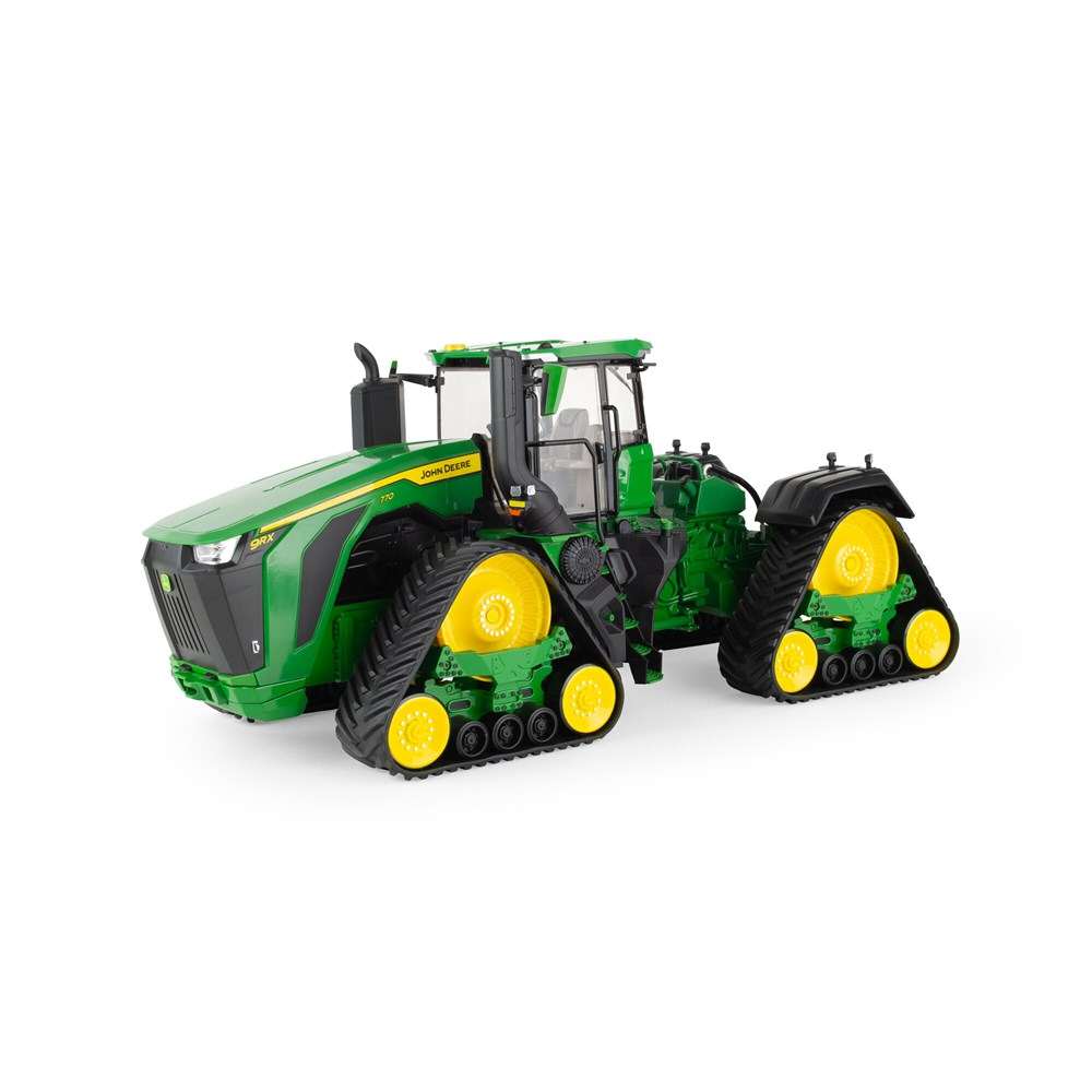 Green and yellow John Deere 9RX 770 tractor model with four tracked undercarriages on a white background
