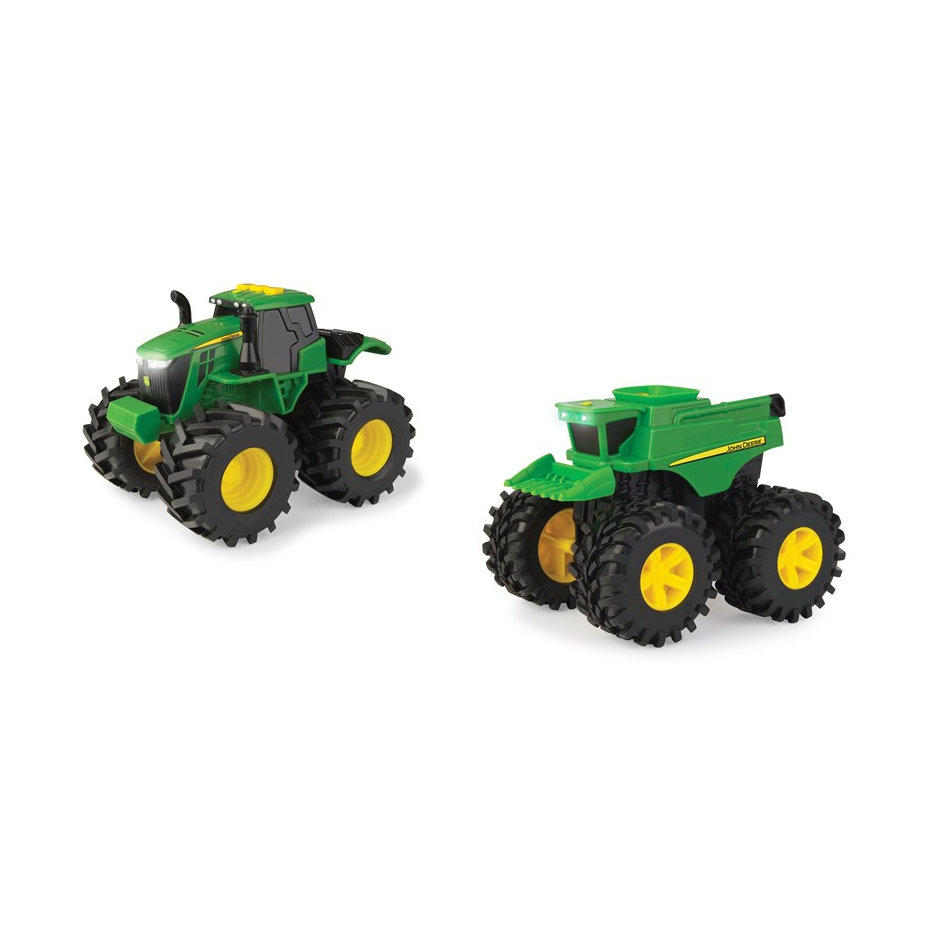 Two green and yellow John Deere Monster Treads toy vehicles, a tractor and combine, on a white background